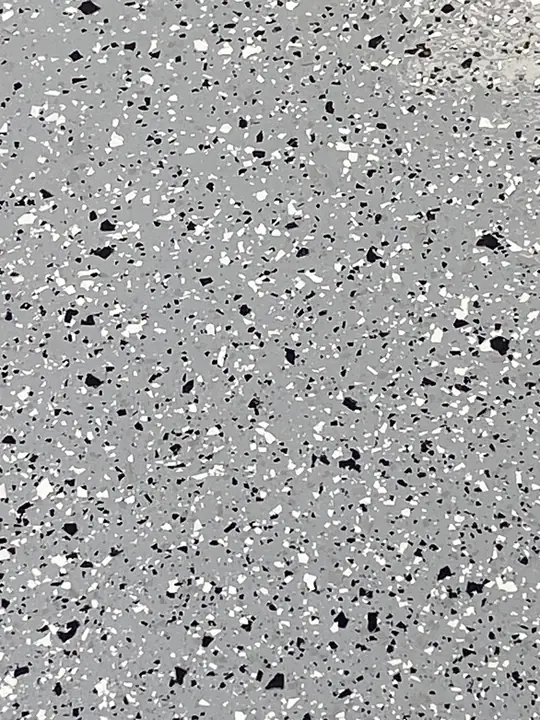 Grey And Black Flake Floor Coating Close Up La Quinta Ca